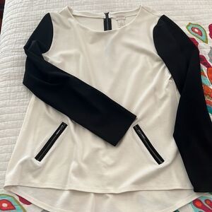 Chico's white top with Black sleeves and faux zipper pockets